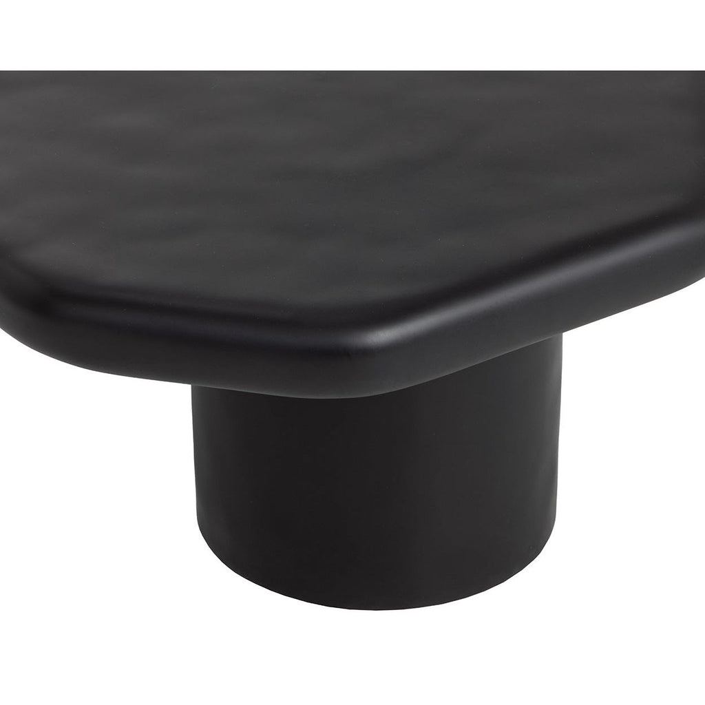 Table basse d'extérieur contemporaine en béton noir, avec une forme géométrique compacte, idéale pour un balcon.
